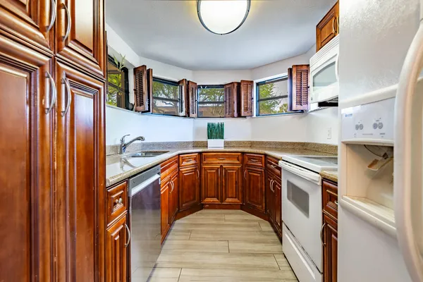 a kitchen with stainless steel appliances granite countertop a stove and a sink