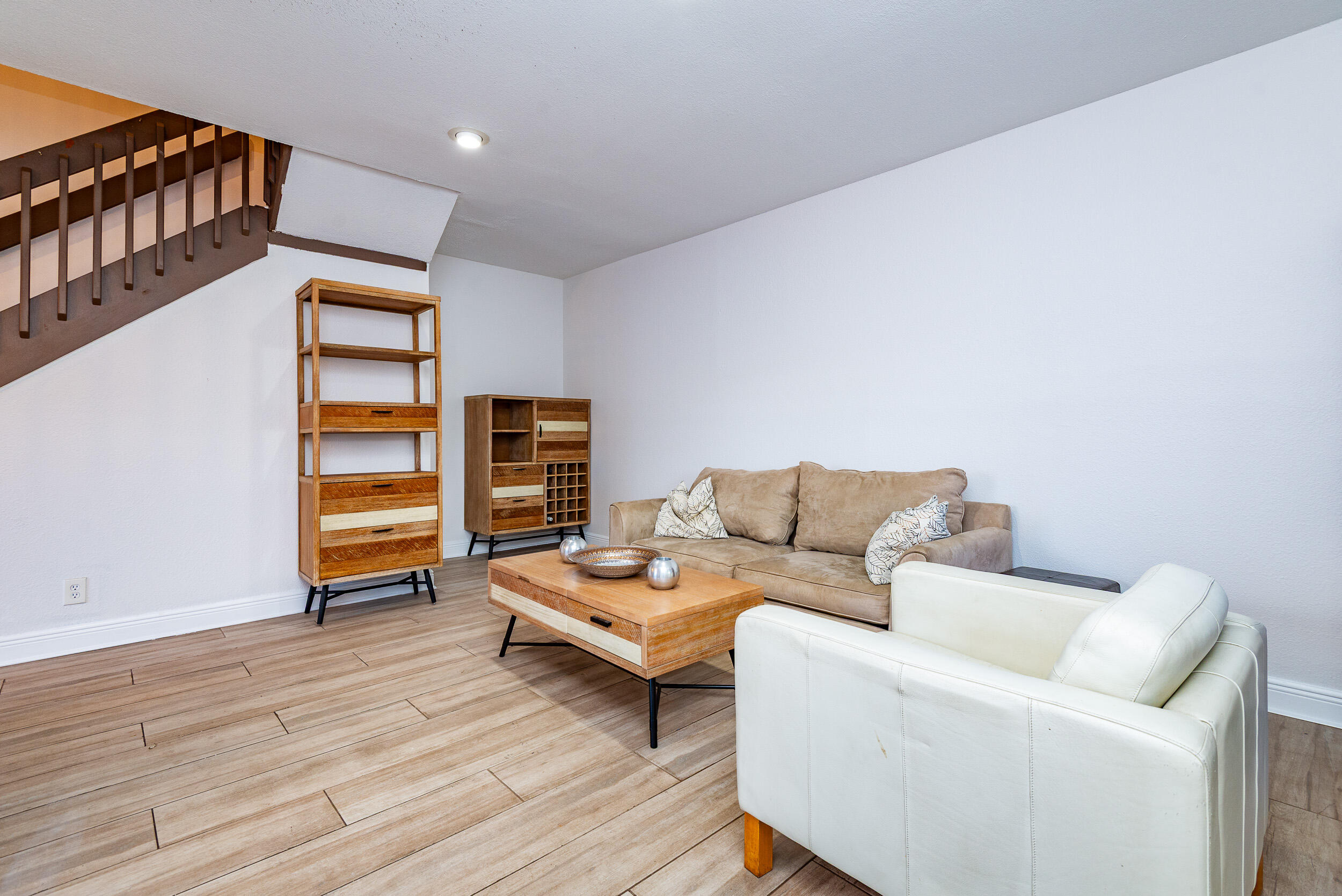 9375 Southwest 61st Way, Unit D Boca Raton, FL 33428 - Photo 10 of 30 a living room with furniture and a wooden floor