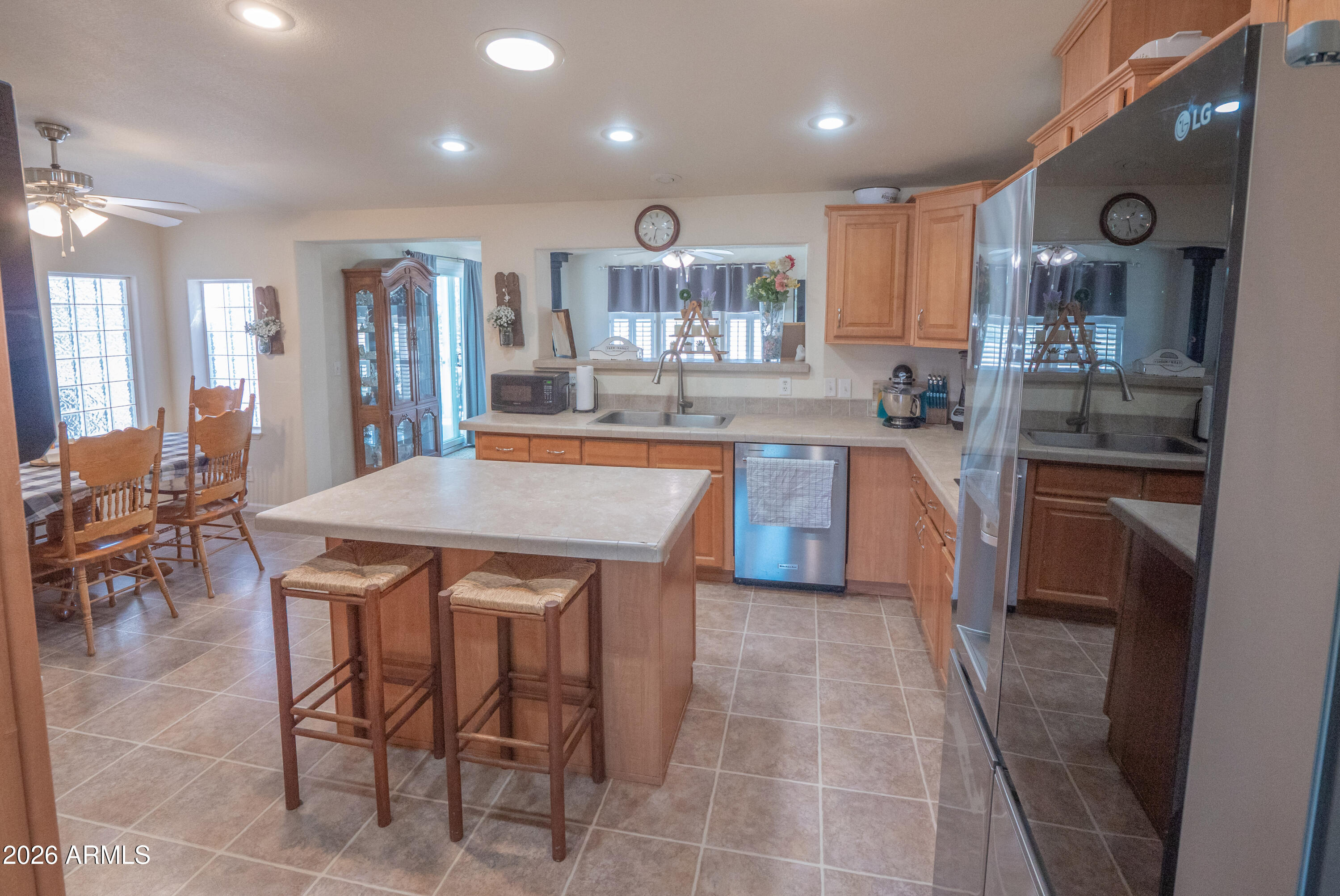 1401 Ranch Road Taylor, AZ 85939 - Photo 13 of 61 a kitchen with stainless steel appliances granite countertop table chairs sink and cabinets