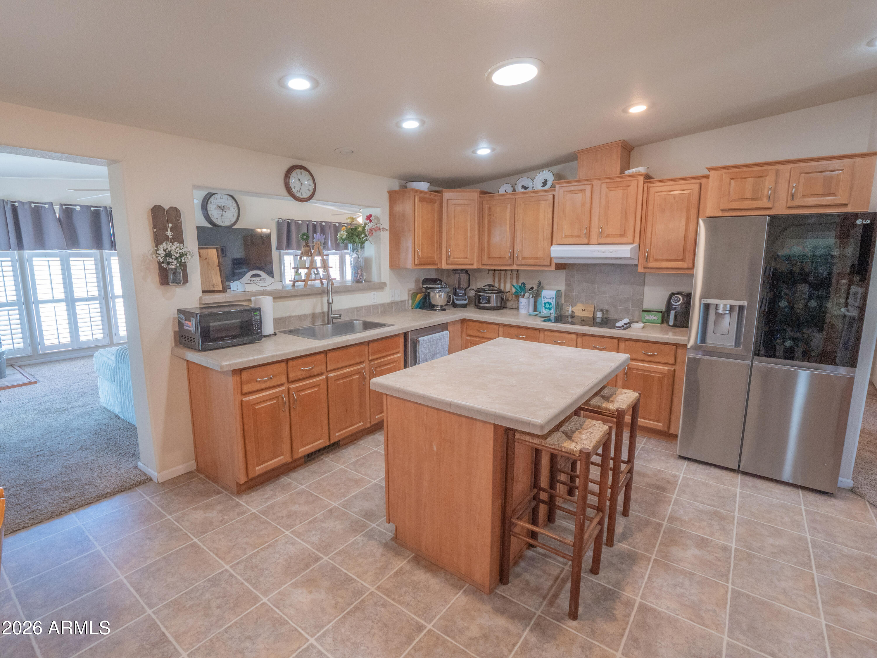 1401 Ranch Road Taylor, AZ 85939 - Photo 15 of 61 a kitchen with a sink a counter top space stainless steel appliances and cabinets