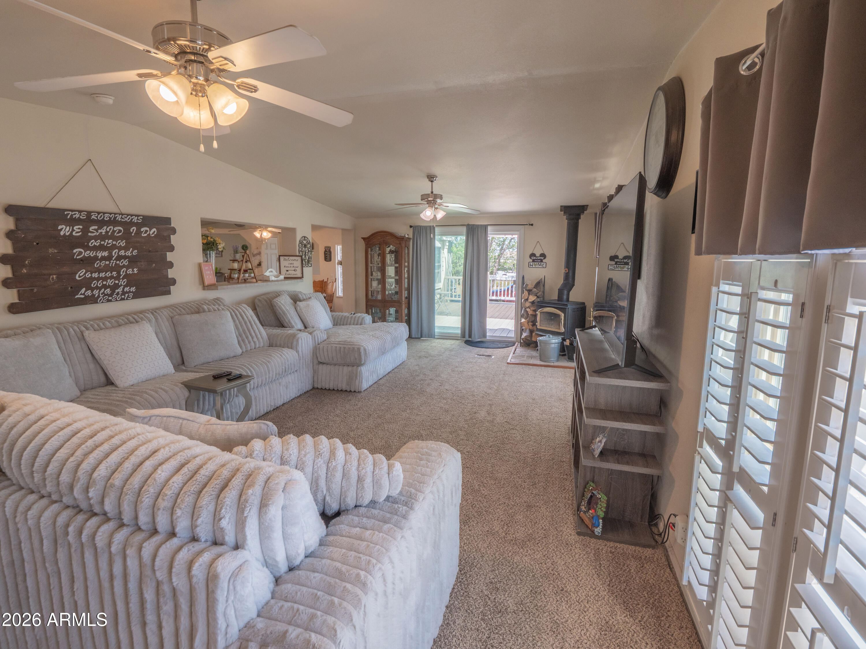 1401 Ranch Road Taylor, AZ 85939 - Photo 23 of 61 a living room with furniture and a chandelier