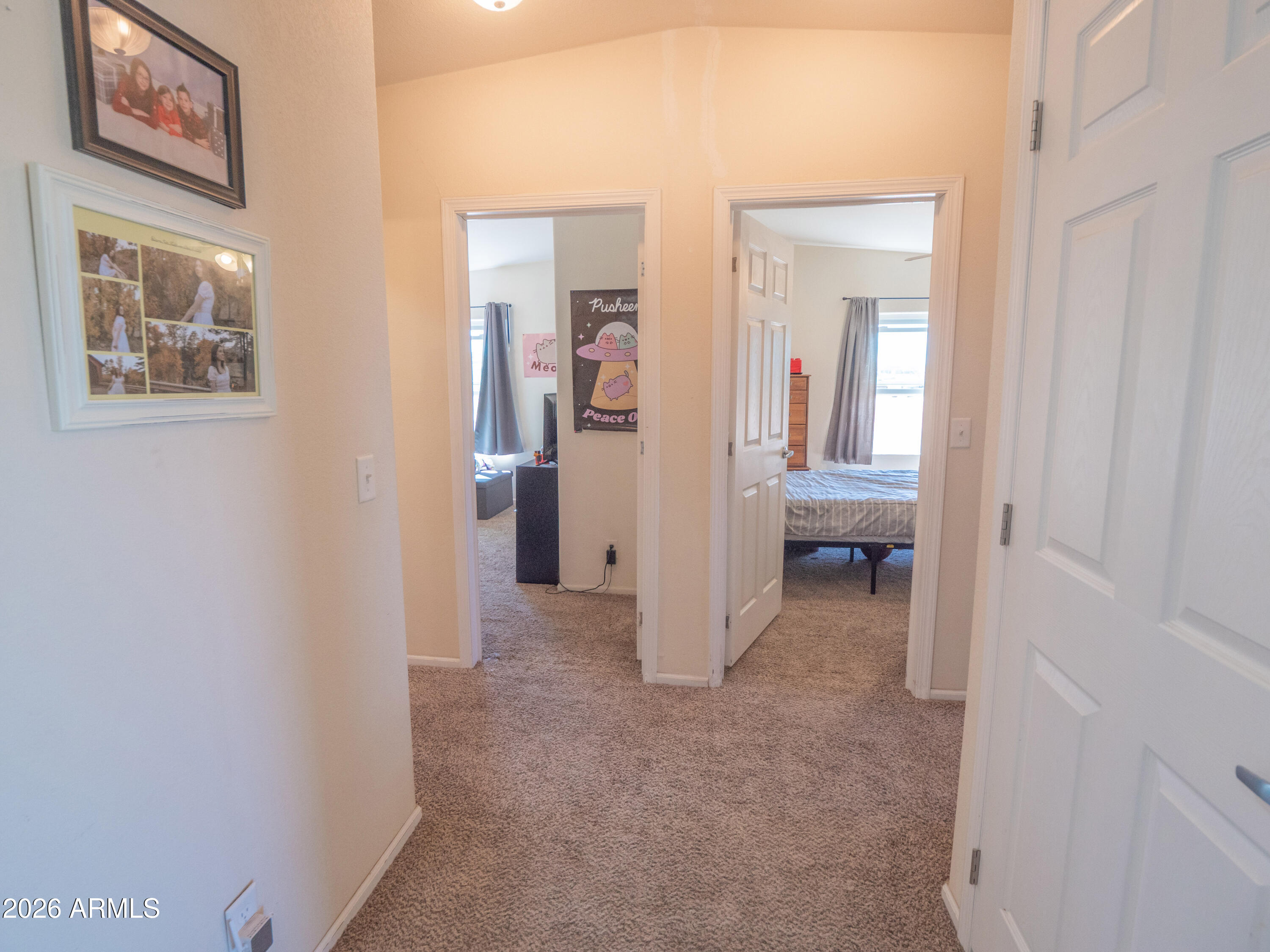 1401 Ranch Road Taylor, AZ 85939 - Photo 28 of 61 a view of a hallway with paintings on the wall