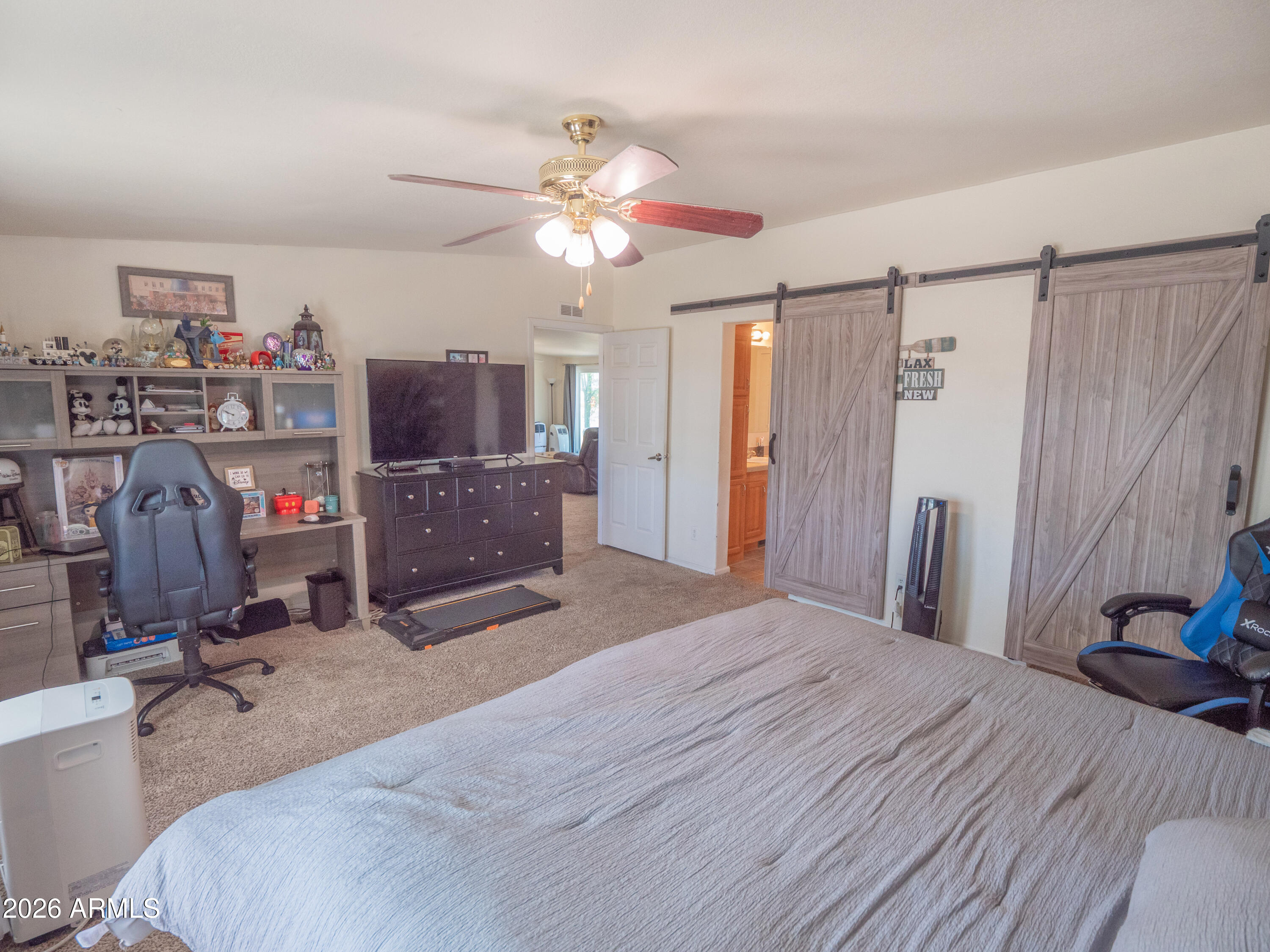 1401 Ranch Road Taylor, AZ 85939 - Photo 30 of 61 a bedroom with a bed and a flat screen tv