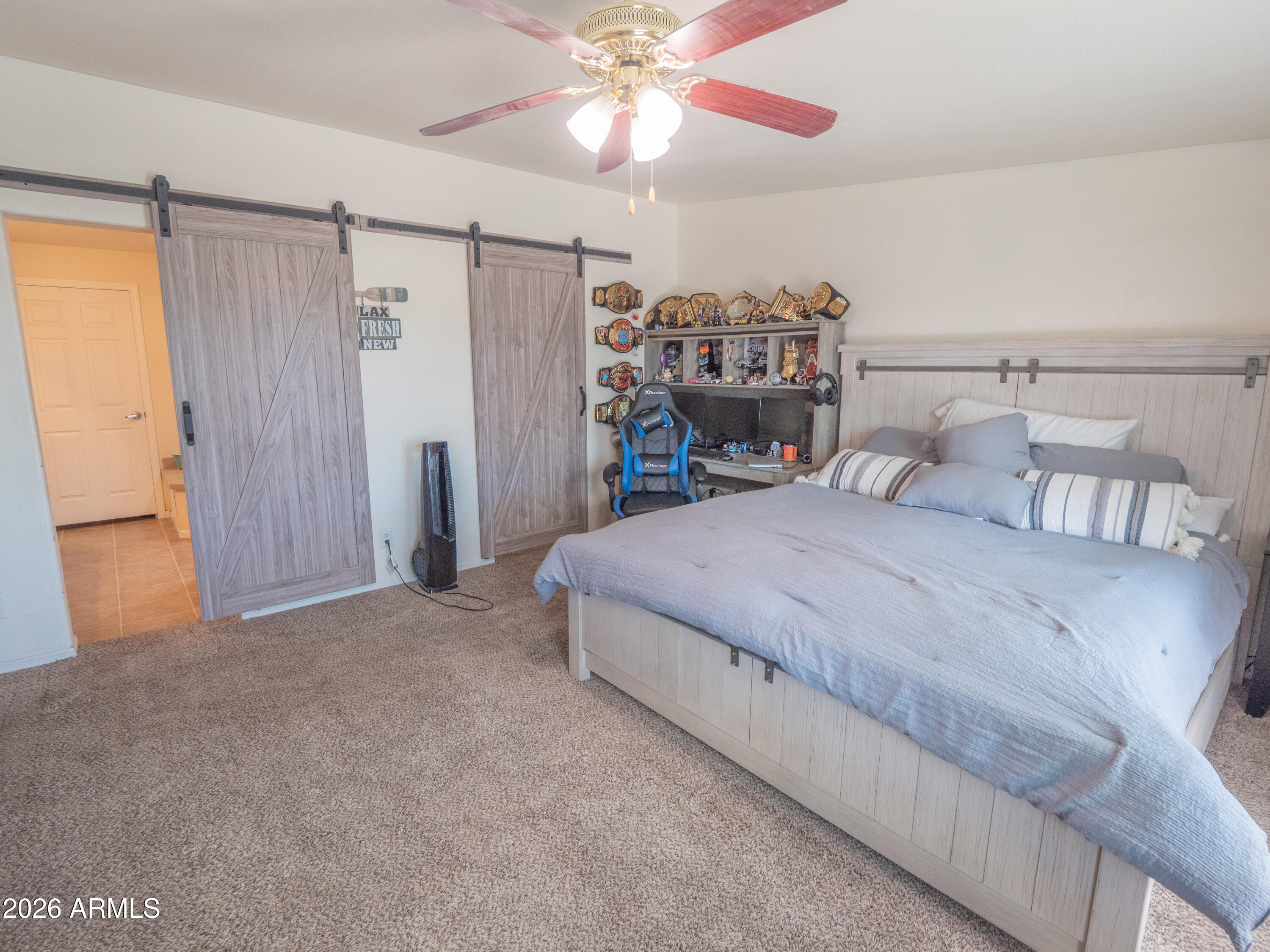 1401 Ranch Road Taylor, AZ 85939 - Photo 31 of 61 a spacious bedroom with a bed and a ceiling fan