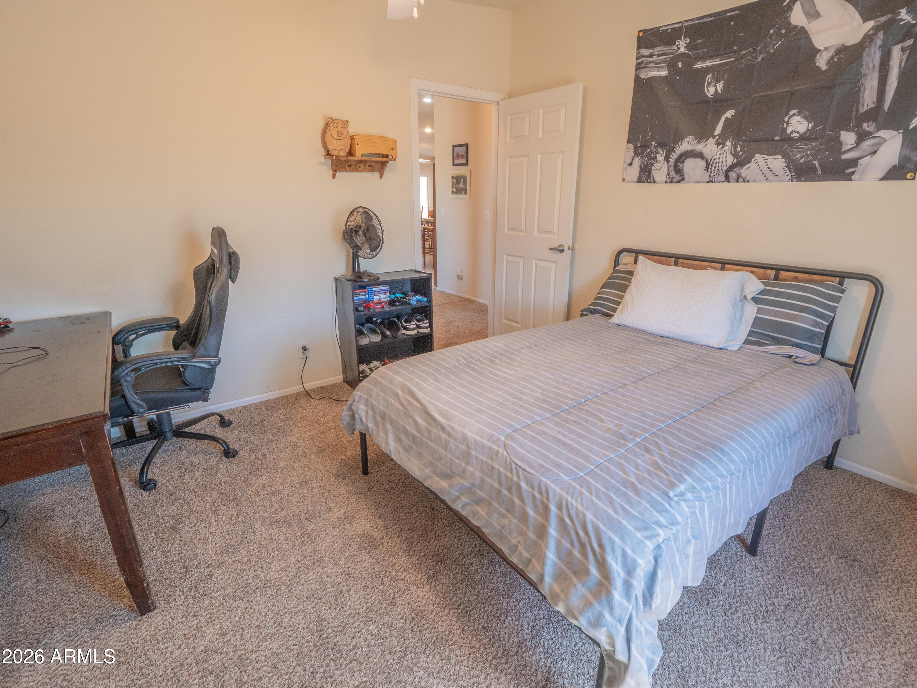 1401 Ranch Road Taylor, AZ 85939 - Photo 39 of 61 a bedroom with a bed and a chair
