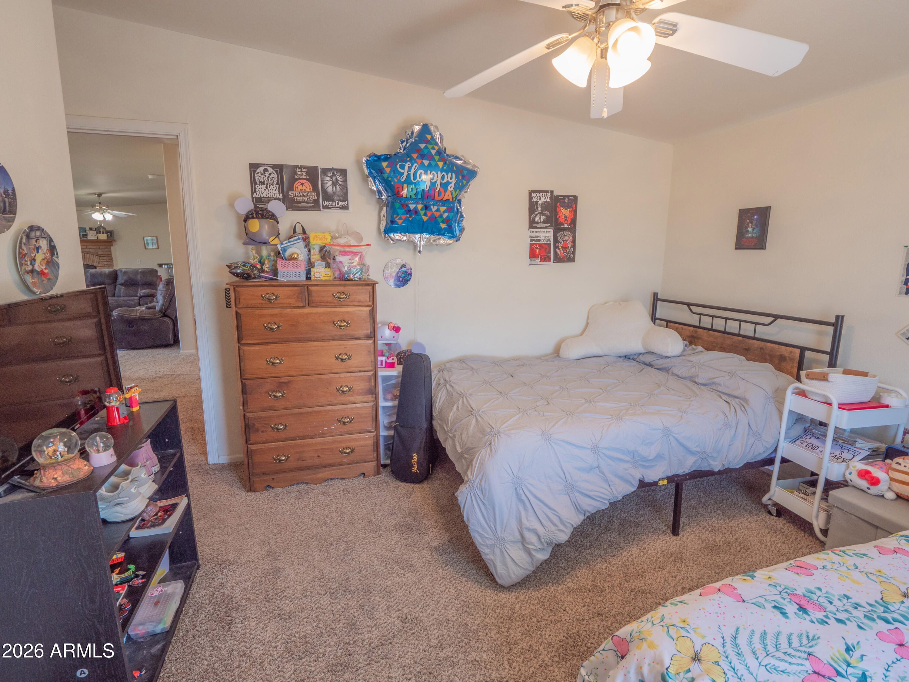 1401 Ranch Road Taylor, AZ 85939 - Photo 41 of 61 a bedroom with a bed and a chandelier