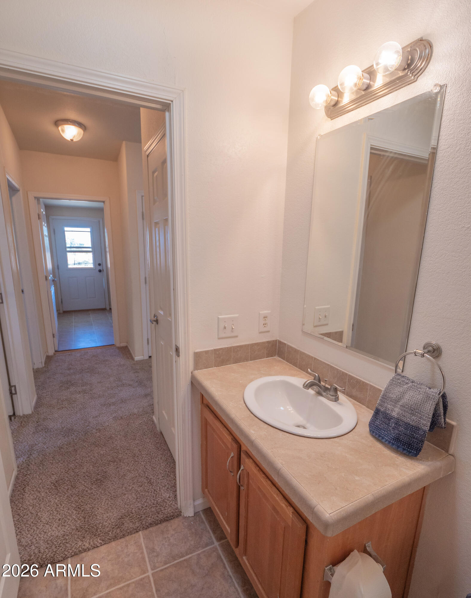 1401 Ranch Road Taylor, AZ 85939 - Photo 43 of 61 a bathroom with a sink and a mirror