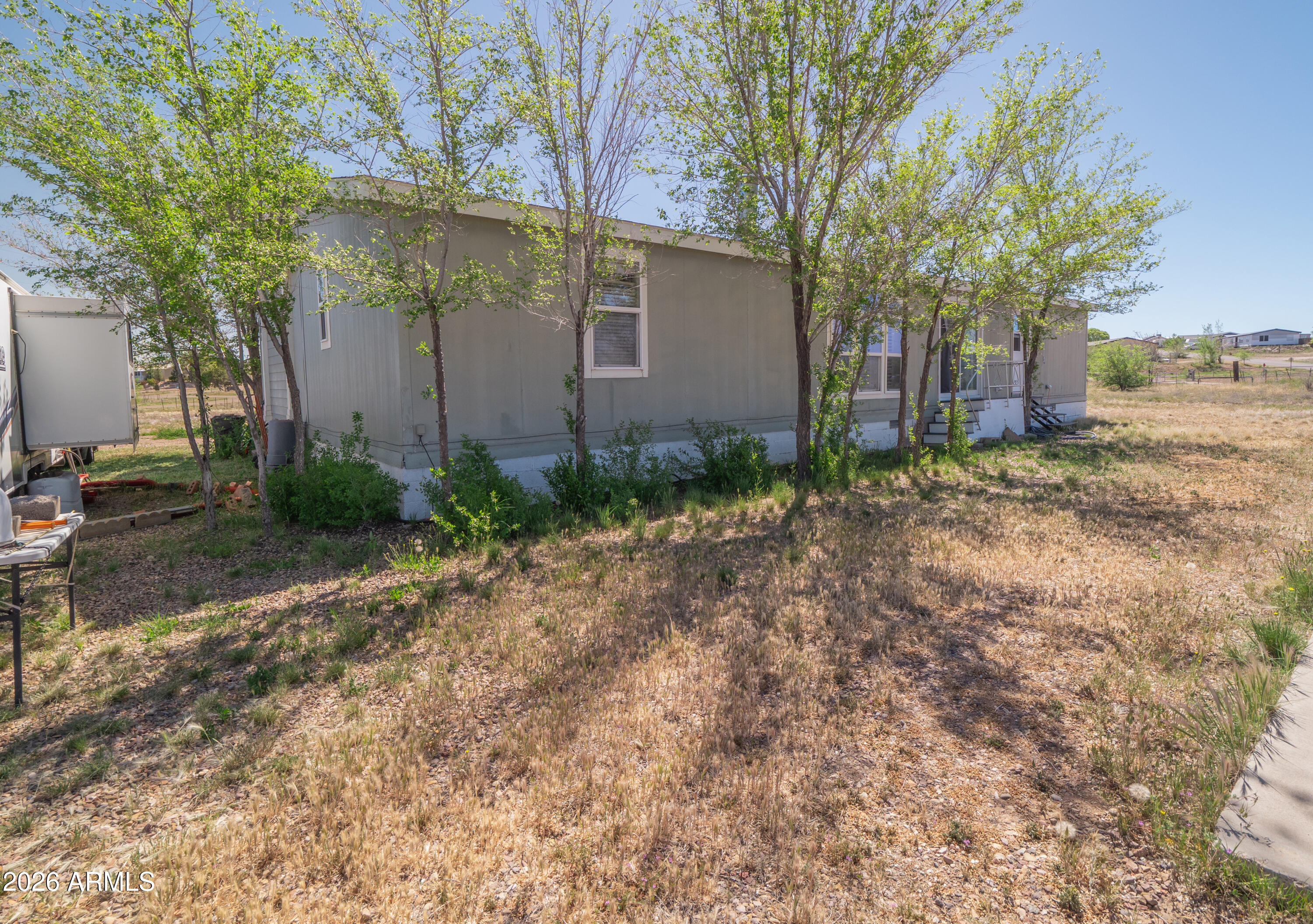 1401 Ranch Road Taylor, AZ 85939 - Photo 48 of 61 a view of a house with a yard and tree