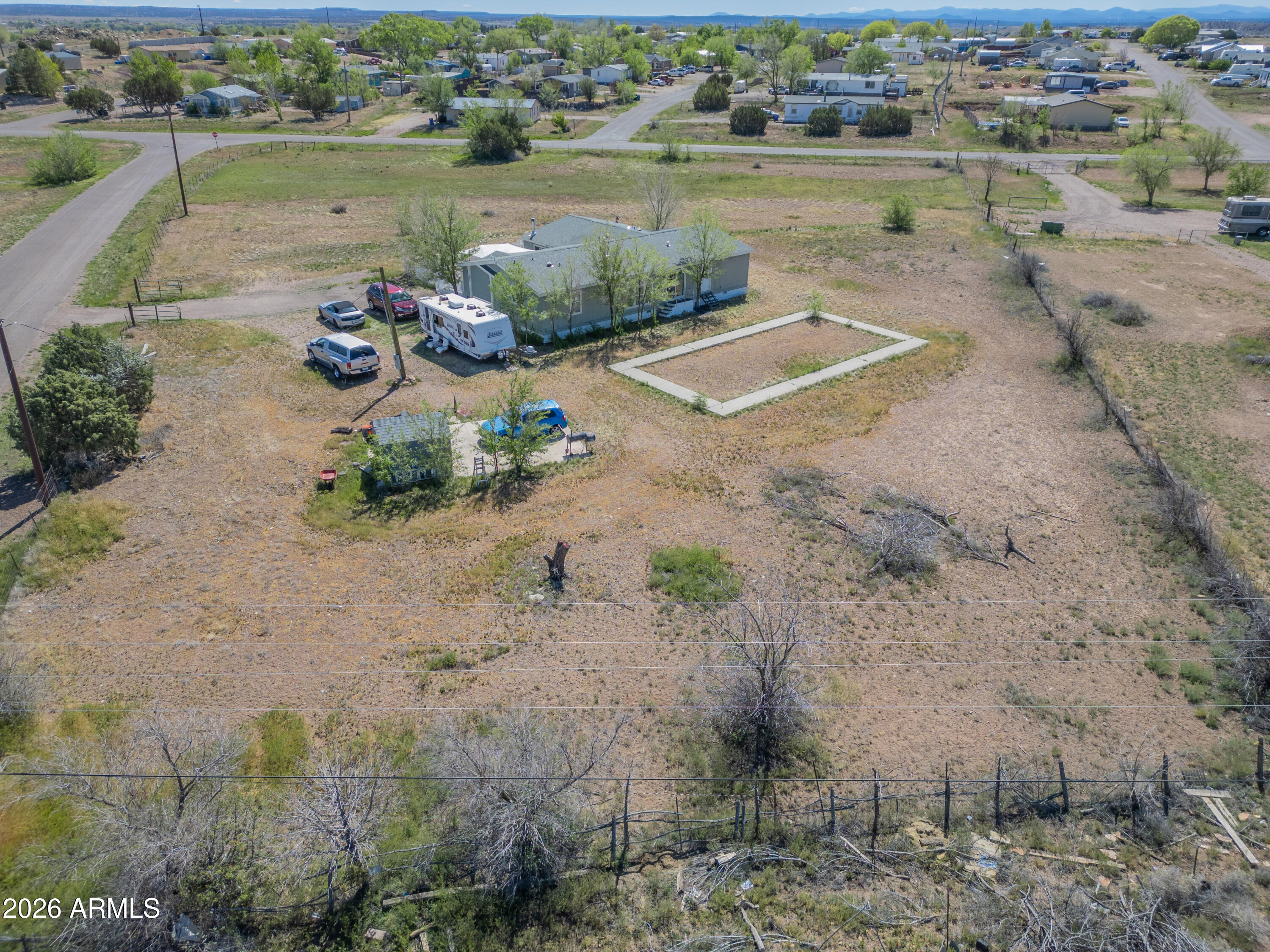 1401 Ranch Road Taylor, AZ 85939 - Photo 60 of 61 an aerial view of a house with a lake view