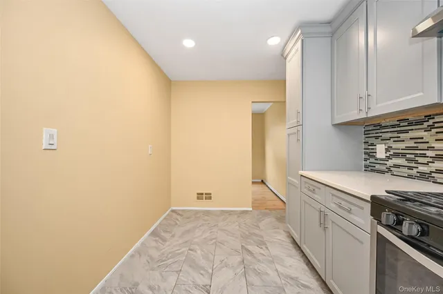 a kitchen with granite countertop cabinets stainless steel appliances and a sink