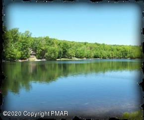 164 Spring Drive Dingmans Ferry, PA 18328 - Photo 11 of 11 a view of a lake with houses