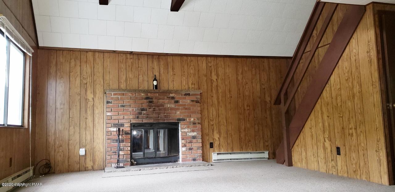164 Spring Drive Dingmans Ferry, PA 18328 - Photo 4 of 11 a view of an entryway with a fireplace