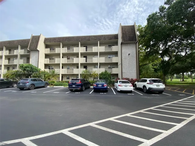 a view of a cars parked in front of a building