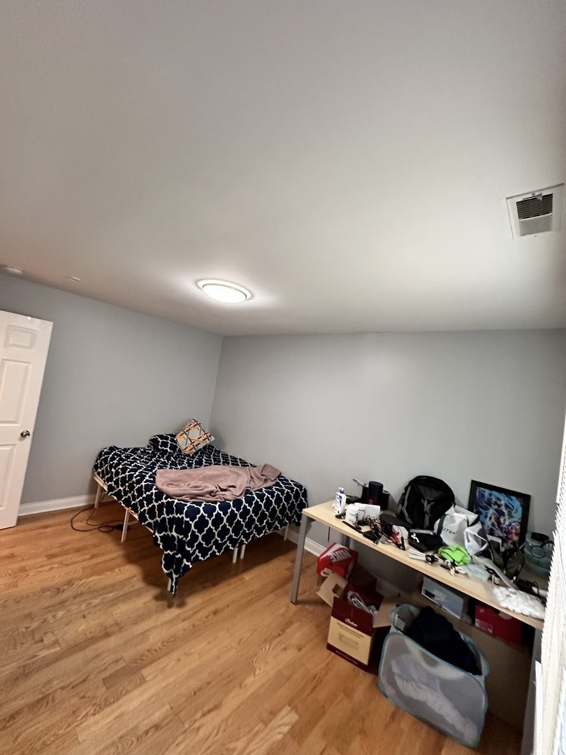 263 Blackberry Drive Bolingbrook, IL 60440 - Photo 18 of 50 a bed room with a bed and a couch