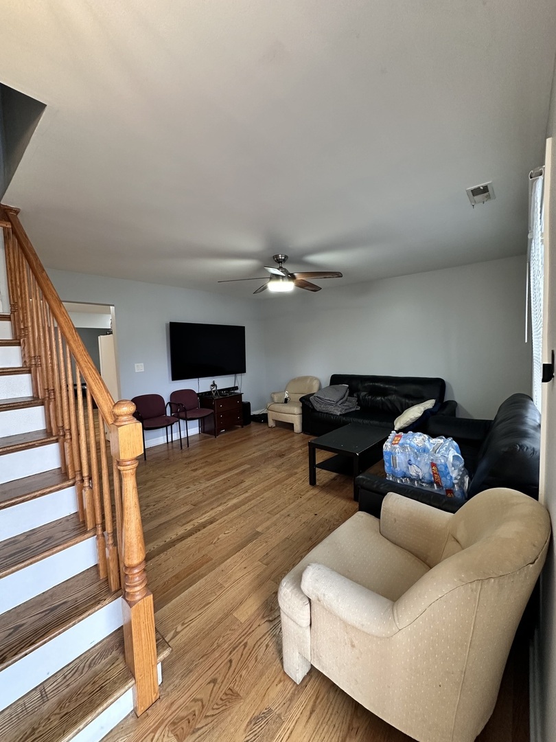 263 Blackberry Drive Bolingbrook, IL 60440 - Photo 2 of 50 a living room with furniture and a flat screen tv