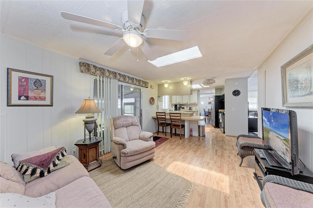 5619 Bayshore Road, Unit 164 Palmetto, FL 34221 - Photo 20 of 42 a living room with furniture and a flat screen tv