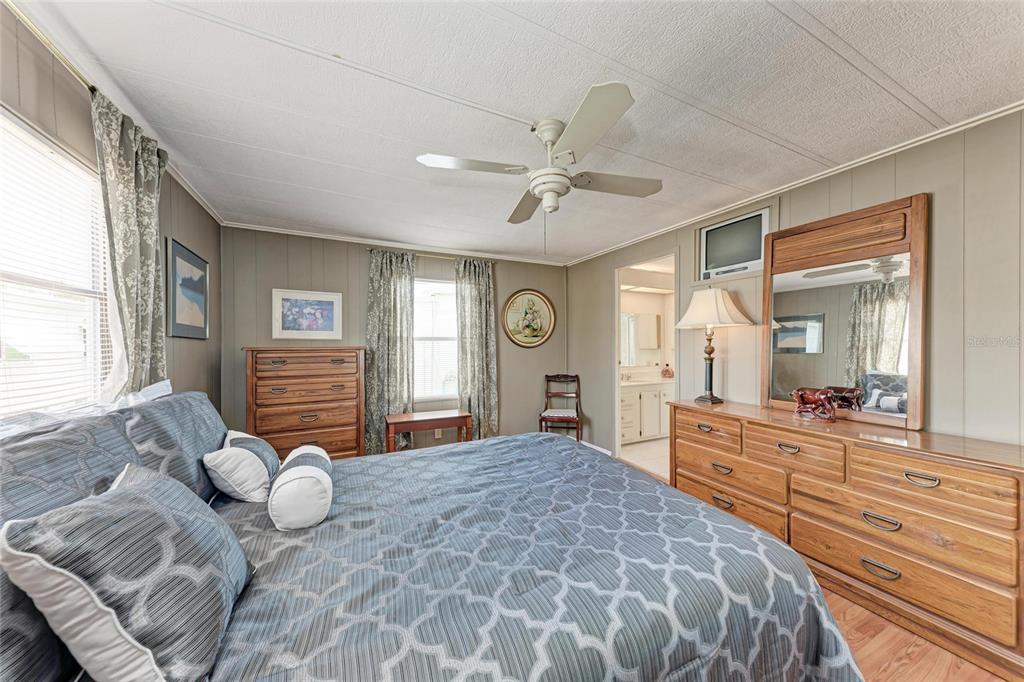 5619 Bayshore Road, Unit 164 Palmetto, FL 34221 - Photo 22 of 42 a bedroom with a large bed and windows