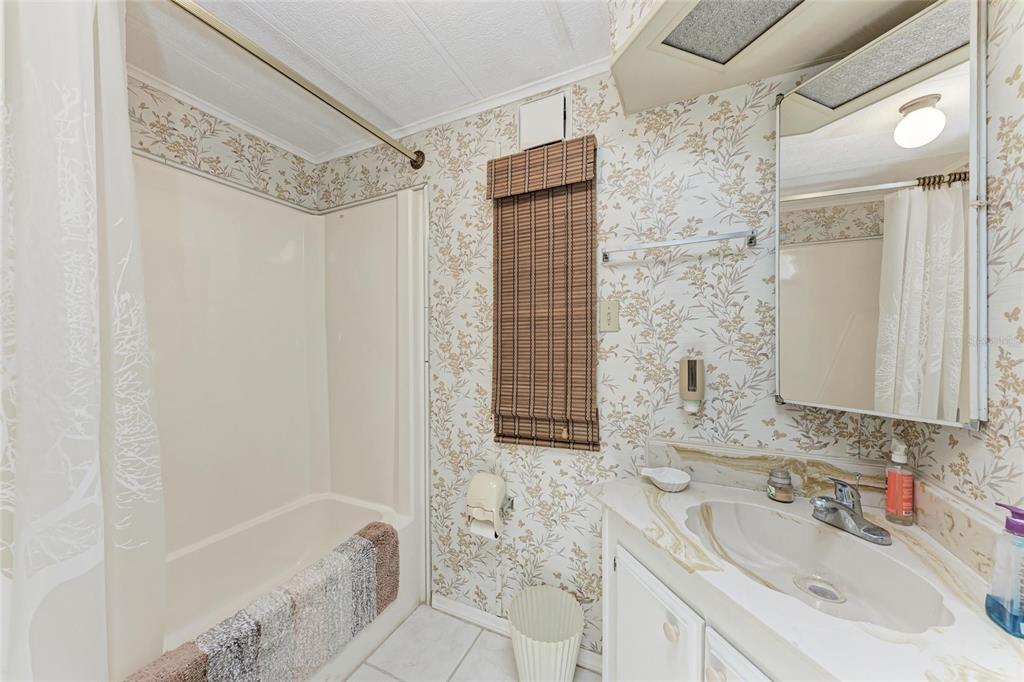 5619 Bayshore Road, Unit 164 Palmetto, FL 34221 - Photo 29 of 42 a bathroom with a sink and a mirror