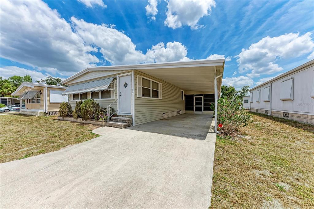5619 Bayshore Road, Unit 164 Palmetto, FL 34221 - Photo 3 of 42 a front view of a house with garden