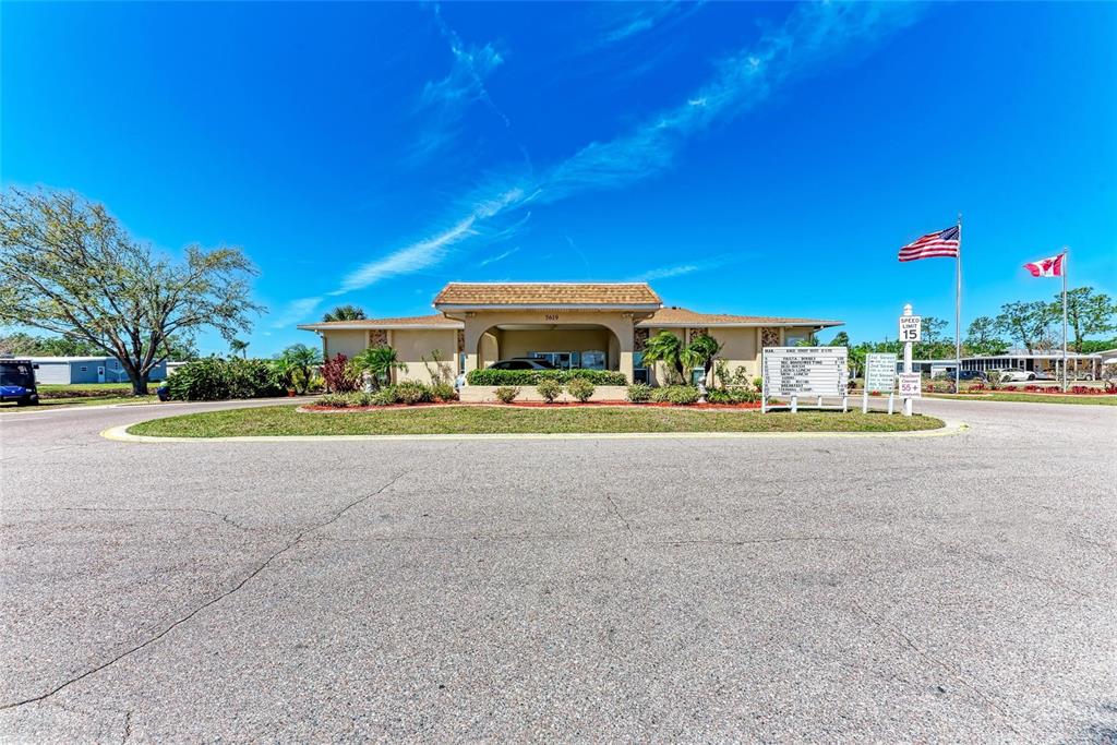 5619 Bayshore Road, Unit 164 Palmetto, FL 34221 - Photo 40 of 42 a view of house with outdoor space and parking