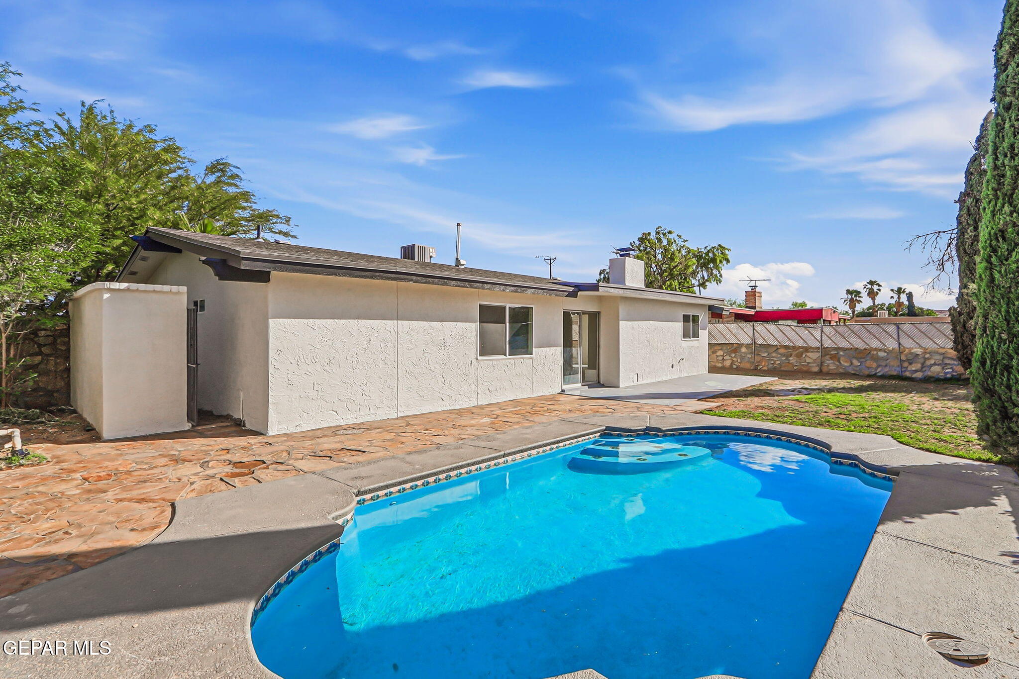 709 Frontera Road El Paso, TX 79922 - Photo 2 of 41 a view of swimming pool with seating space