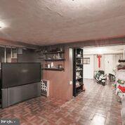 1327 Pentwood Road Baltimore, MD 21239 - Photo 24 of 32 Tiled Lower Level Family Room