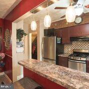 1327 Pentwood Road Baltimore, MD 21239 - Photo 6 of 32 Two Sided Corian Breakfast Bar