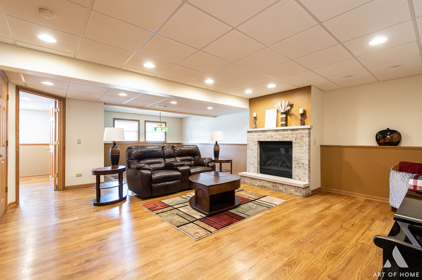 407 Wimbleton Trail McHenry, IL 60050 - Photo 20 of 38 a living room with furniture a fireplace and a flat screen tv