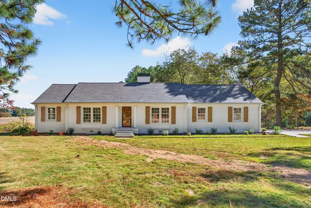 a picture of a room with a white wall and sign