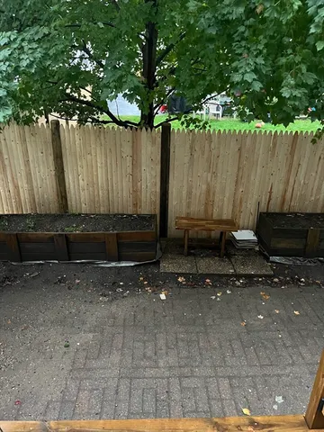 a view of outdoor space with wooden fence