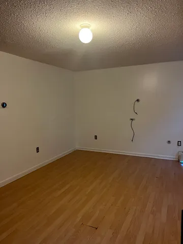 an empty room with a fan