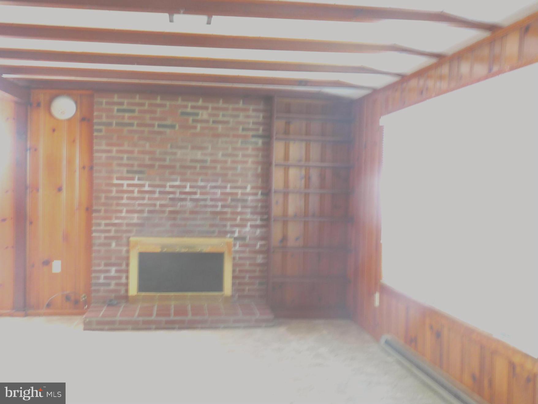 379 Gun Club Road Stephenson, VA 22656 - Photo 30 of 30 Cozy brick gas fireplace