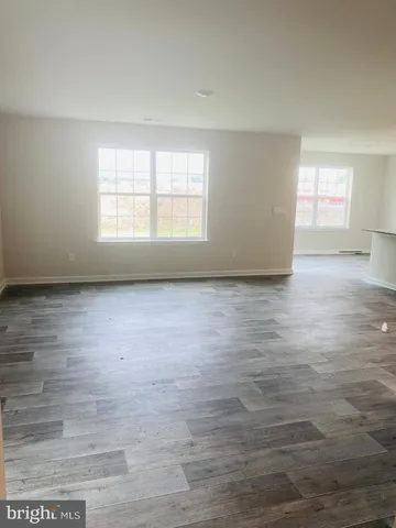 a kitchen with granite countertop a sink and a stove top oven