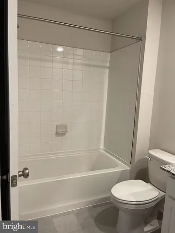 a backyard of a house with lots of green space and plants