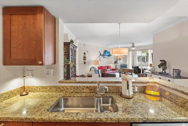 a kitchen with sink a granite counter top and a granite counter top