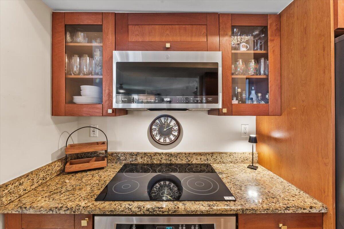 815 Northwest Flagler Avenue, Unit 201 Stuart, FL 34994 - Photo 12 of 43 a living room with furniture and a flat screen tv