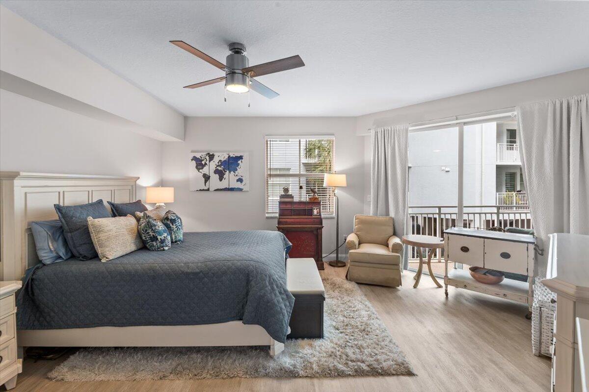 815 Northwest Flagler Avenue, Unit 201 Stuart, FL 34994 - Photo 16 of 43 a bedroom with a bed and a couch