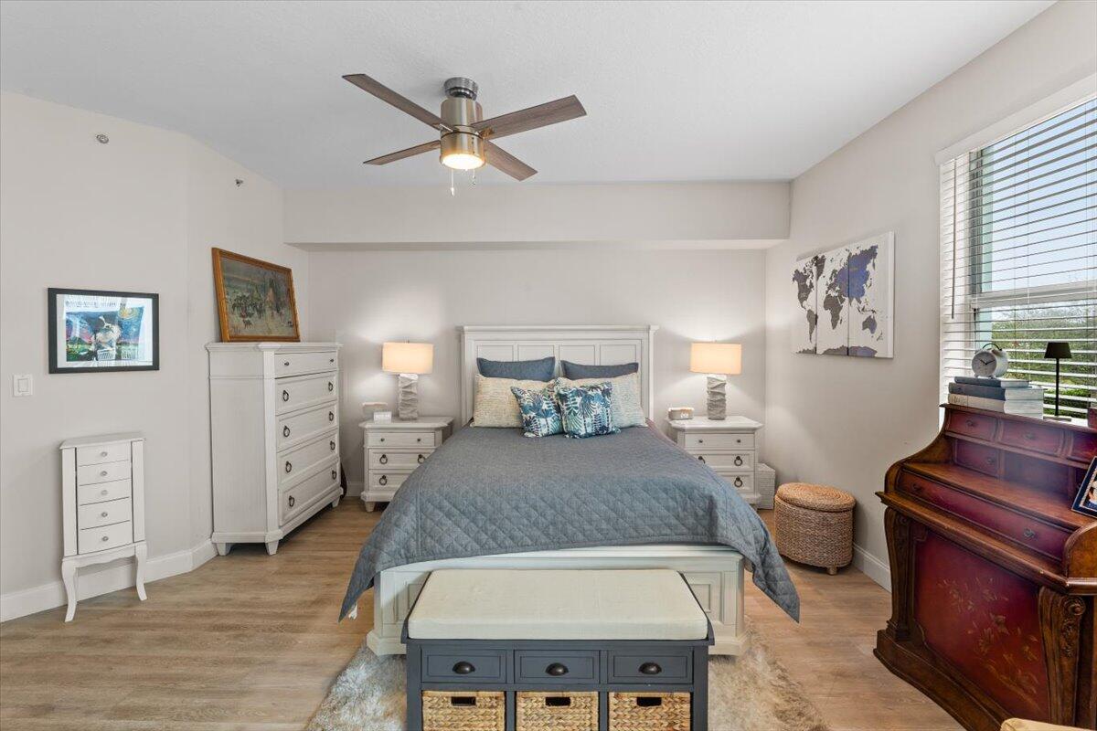 815 Northwest Flagler Avenue, Unit 201 Stuart, FL 34994 - Photo 17 of 43 a living room with furniture and a wooden floor