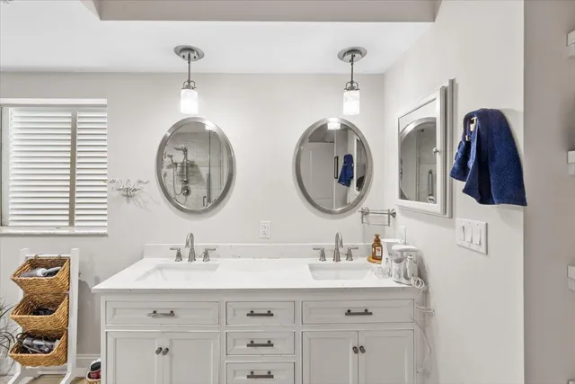 a bathroom with a sink and a mirror with painted walls