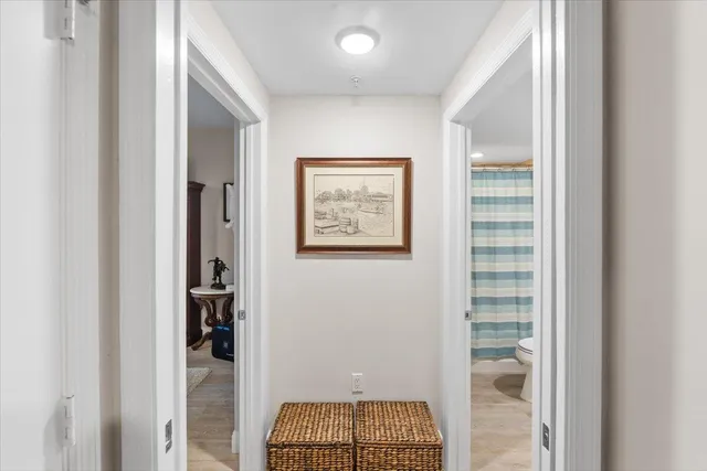 a view of room with walk in closet and bathroom
