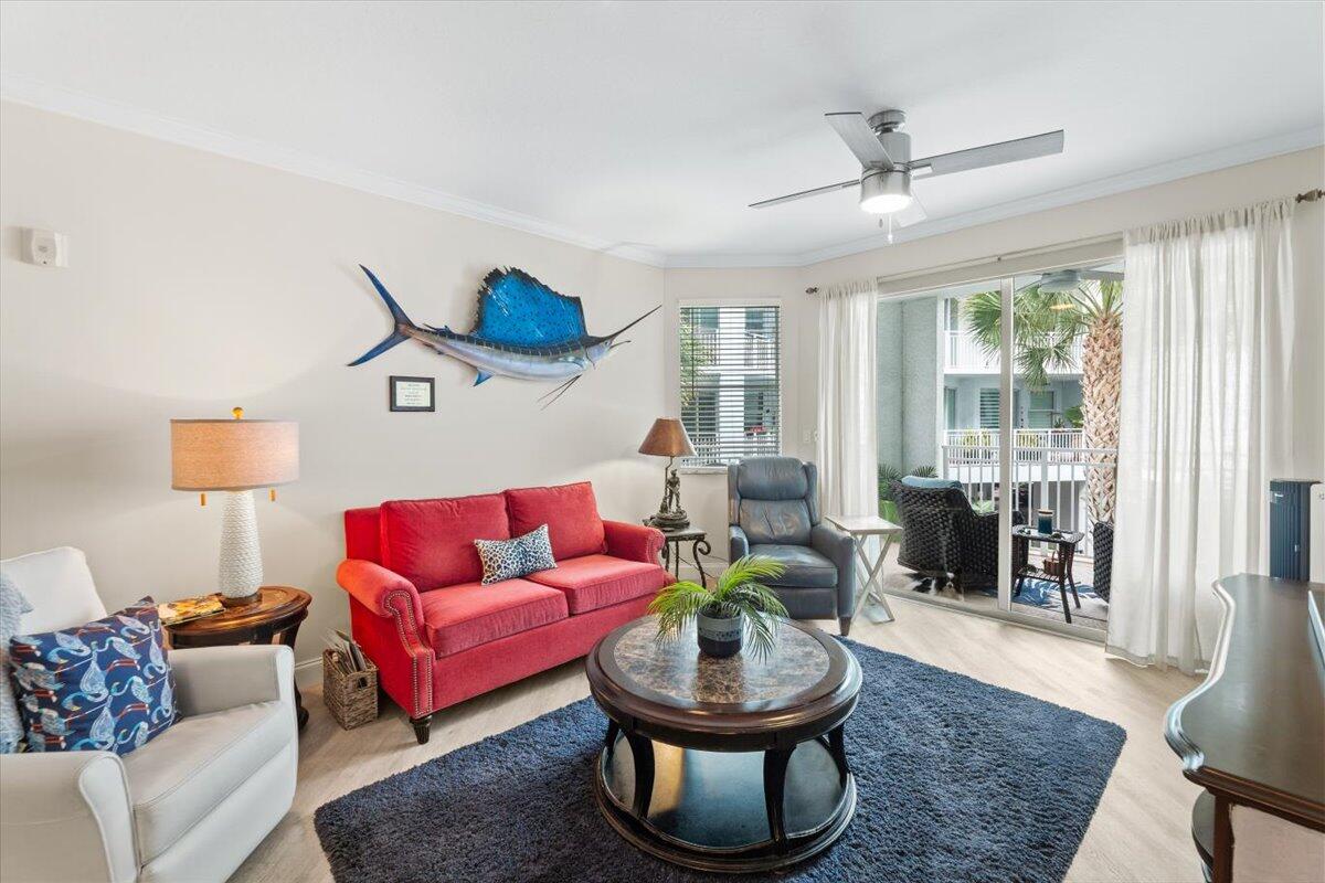 815 Northwest Flagler Avenue, Unit 201 Stuart, FL 34994 - Photo 3 of 43 a living room with furniture and a large window