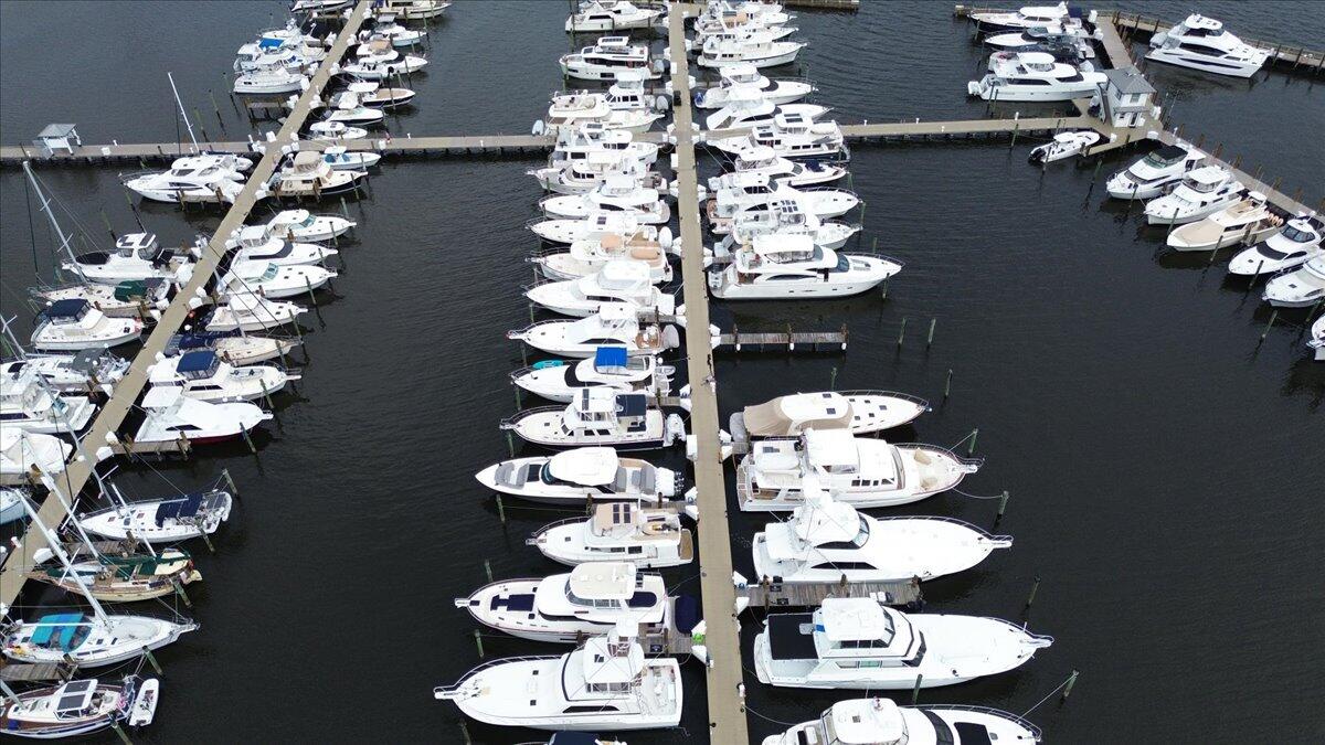 815 Northwest Flagler Avenue, Unit 201 Stuart, FL 34994 - Photo 41 of 43 a bathroom with a vase of flowers sitting on a table