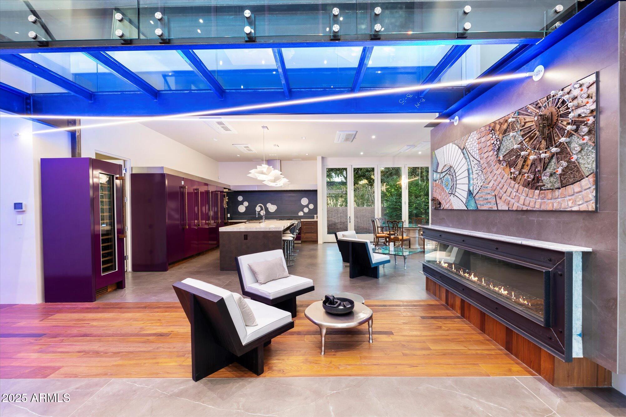 341 East Monte Vista Road Phoenix, AZ 85004 - Photo 19 of 77 a living room with furniture a rug and a fireplace