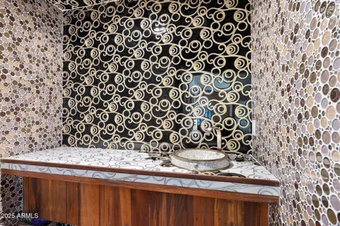 a view of a house with swimming pool and sitting area