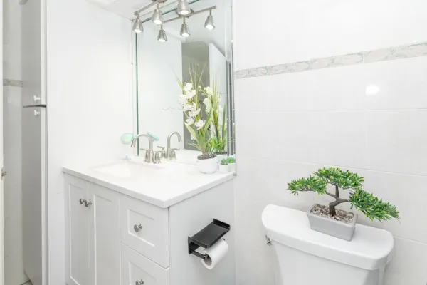 a bedroom with a bed and a desk