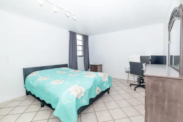 a view of an empty room and closet