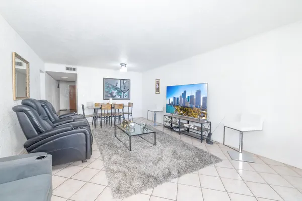 a living room with furniture and a table