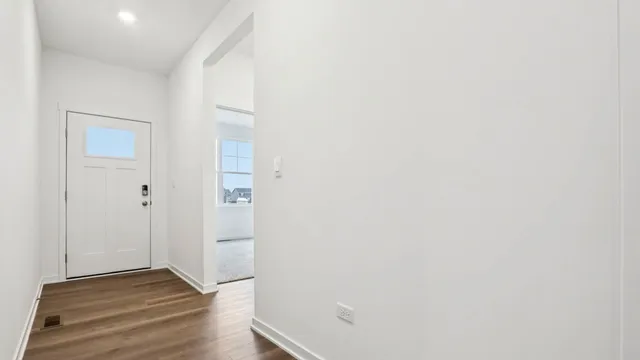 a kitchen with stainless steel appliances a sink dishwasher stove refrigerator and wooden cabinets