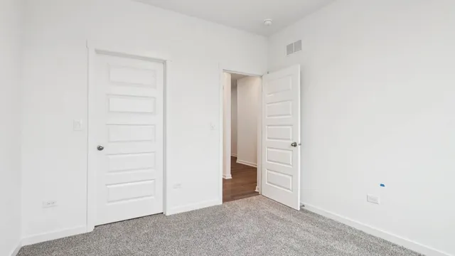 a view of a kitchen with a sink and a refrigerator