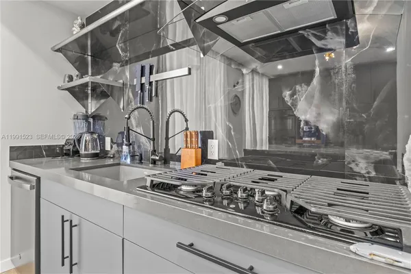 a kitchen with a sink and cabinets